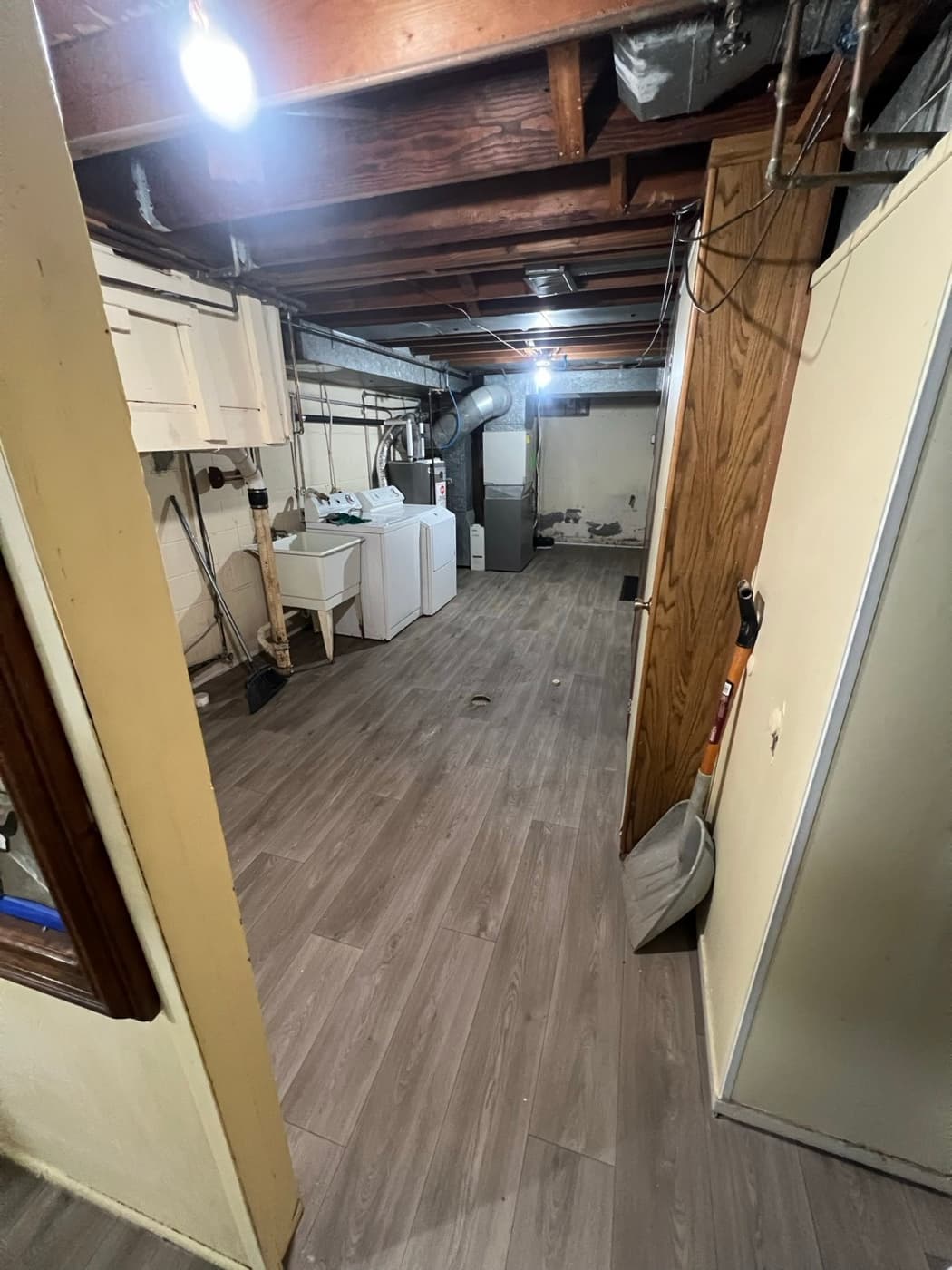 New luxury vinyl plank flooring installed in a Metro Detroit basement